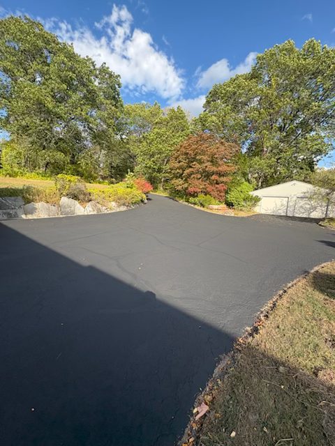 Same driveway after sealcoating - smooth black finish