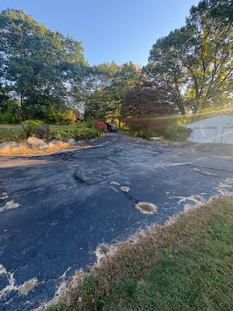 Driveway before sealcoating - cracked and weathered